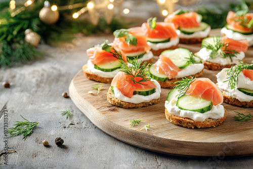 Festive smoked salmon canapés with cream cheese, cucumber, dill, served on wooden board, holiday party snack, gourmet appetizer concept