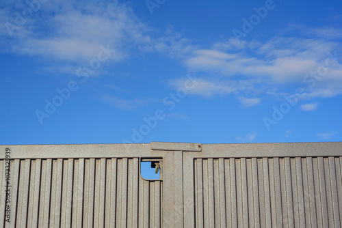 Puerta de metal corrugado en exterior soleado photo