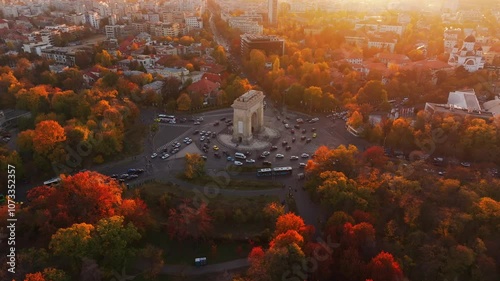 Arch of Triumph in Bucharest, visit Romania. Aerial 4K video with Arch of Triumph historical landmark in Bucharest during a beautiful autumn sunset.