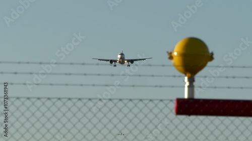 A Passenger Plane Flies Highin the Sky above the Clouds photo