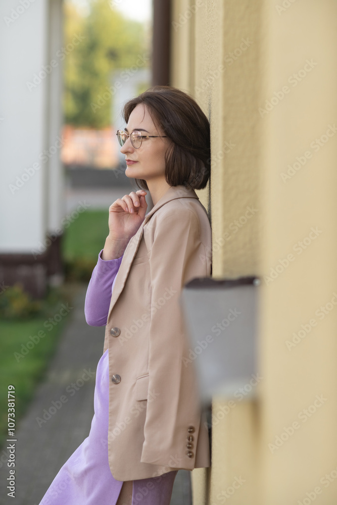 Portrait of a young beautiful dark-haired girl in a dress outdoors. Portrait of a young beautiful dark-haired girl in a dress outdoors.