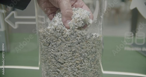 Recycled Raw Plastic Material for Industrial Processing. Close-up of raw recycled plastic material, showcasing the circular economy in action.  Highlights sustainable practices in waste managment.