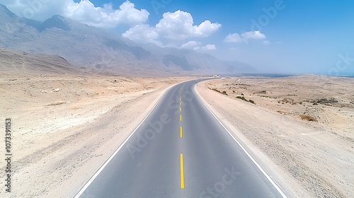 Wallpaper Mural Explore the endless road leading through breathtaking desert landscapes under bright blue skies Torontodigital.ca