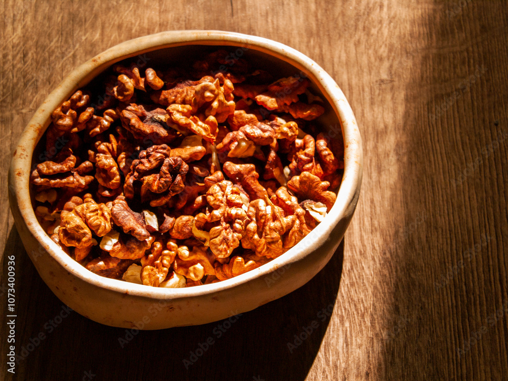 Peeled walnut lies in a bowl Peeled walnut lies in a bowl
