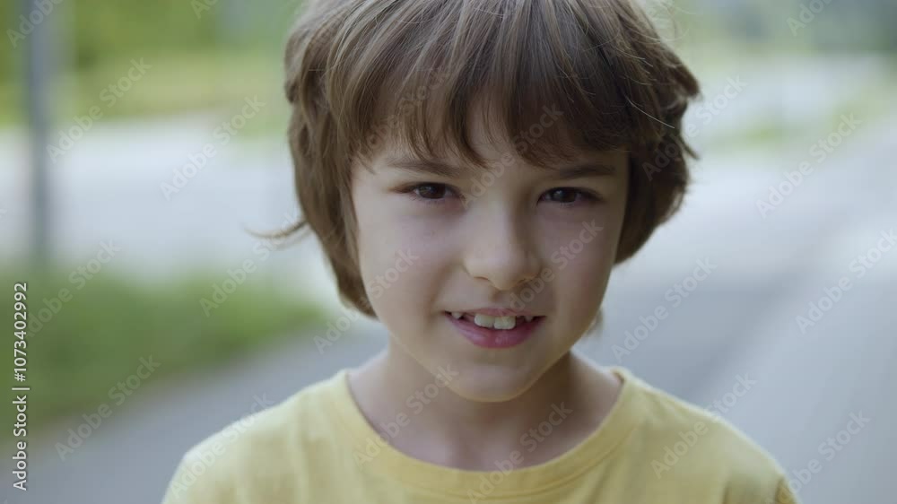 Portrait Smiling Teenage Boy Looking at Camera in Summer Sun Day. Laughs Happily Child at Outdoors. Inquisitive Little Boy Portrait. Happy Face Funny Contemplative Child Smile Freedom and Wellness. Portrait Smiling Teenage Boy Looking at Camera in Summer Sun Day. Laughs Happily Child at Outdoors. Inquisitive Little Boy Portrait. Happy Face Funny Contemplative Child Smile Freedom and Wellness.