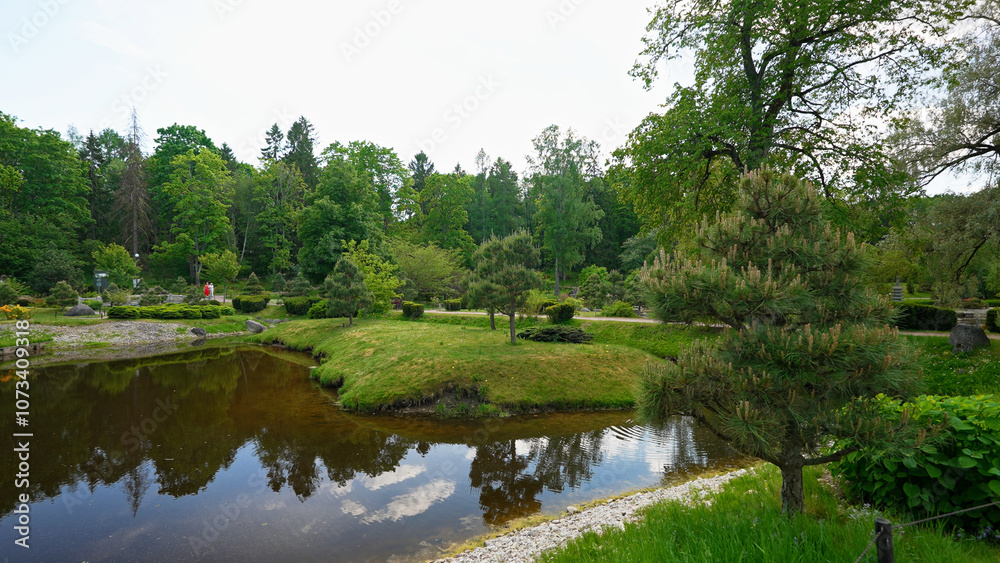 Picturesque Japanese garden with a pond. Picturesque Japanese garden with a pond.