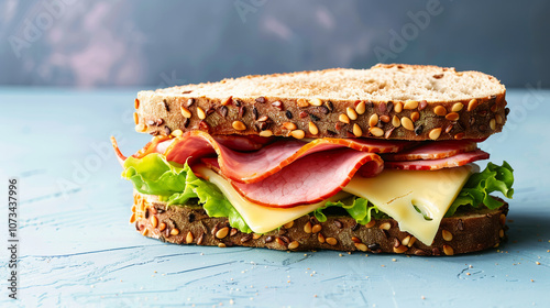 Tasty sandwich featuring ham, cheese, fresh lettuce stacked between bread