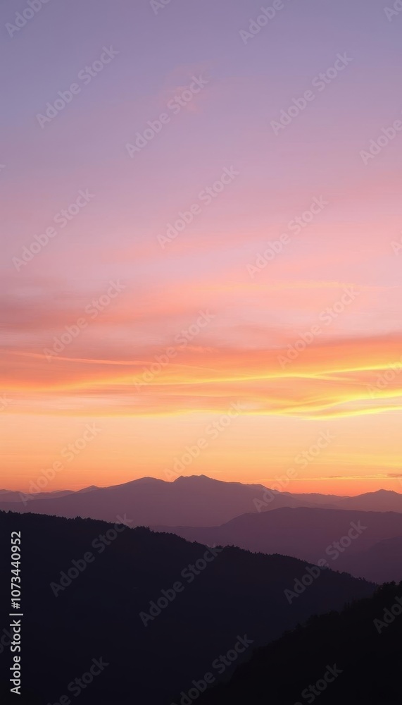 Fototapeta premium the sky at sunset with mountains in the background