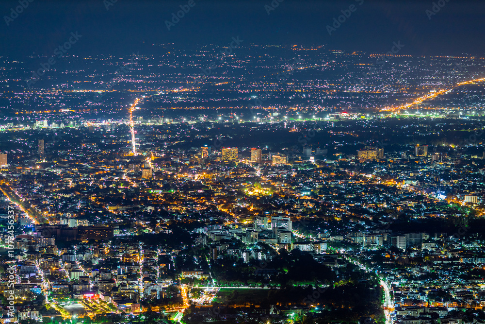 High angle view background from the mountain, showing the lights of apartment buildings, houses, car lights and street lights, the advancement of technology and electricity lighting at night. High angle view background from the mountain, showing the lights of apartment buildings, houses, car lights and street lights, the advancement of technology and electricity lighting at night.
