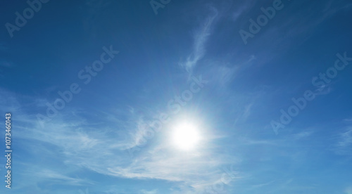 The sky is blue and clear with a sun shining brightly