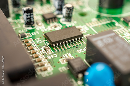 Close-up of a circuit board with microcircuits from an electrical appliance or computer. Selective focus.