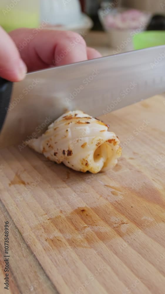 Chef Slices Amberjack Fish On A Wooden Cutting Board