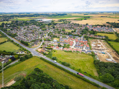 Принти на полотні Aerial view of a typical British road bypass seen next to an East Anglia village