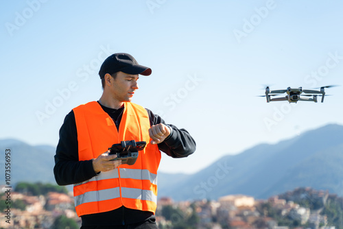 Drone Pilot safely receiving drone using remote controller - Concept of return to home, aerial survey using UAV technology photo