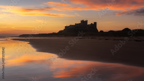 Fototapeta Naklejka Na Ścianę i Meble -  Bamburgh Castle at sunrise, Northumberland, England, UK