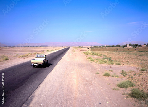 Pickup driving at a road in the country side of Yemen