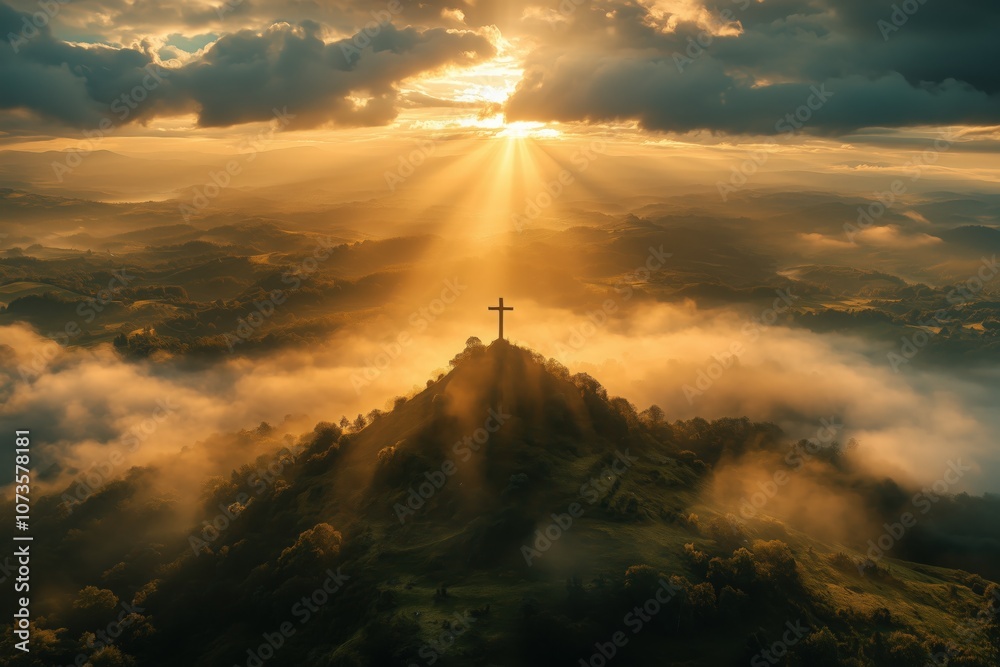 Fototapeta premium A soft ray of sunlight piercing through the clouds, illuminating a solitary wooden cross on a hilltop. The surrounding landscape is bathed in a warm golden glow, signifying faith and hope