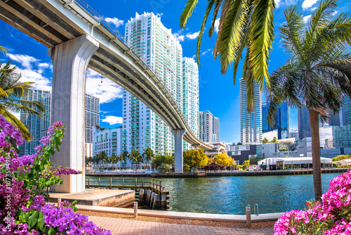 Wallpaper Mural Miami downtown skyline and futuristic mover train above Miami river flower view Torontodigital.ca