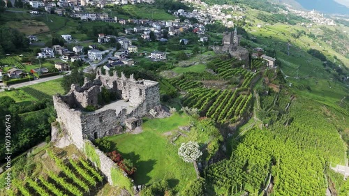 Aerial orbit view of Castel Grumello and vineyards, Sondrio, Valtellina , Italy, 