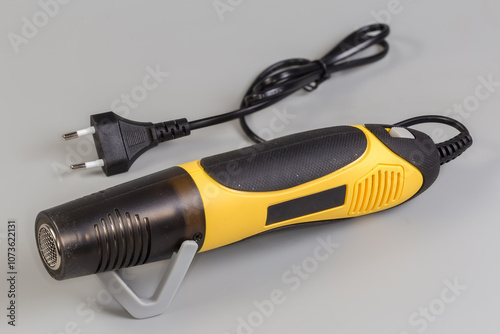 Electric heat gun on a gray background photo