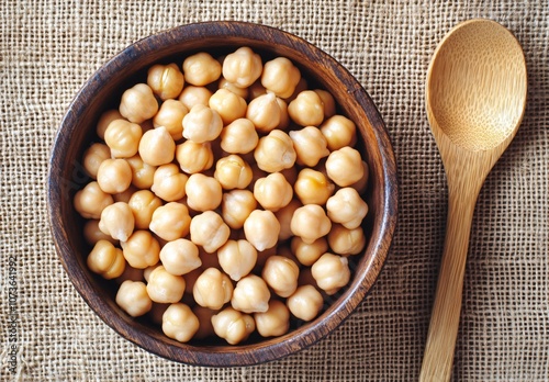 Top View Chickpeas in Wooden Bowl with Spoon photo