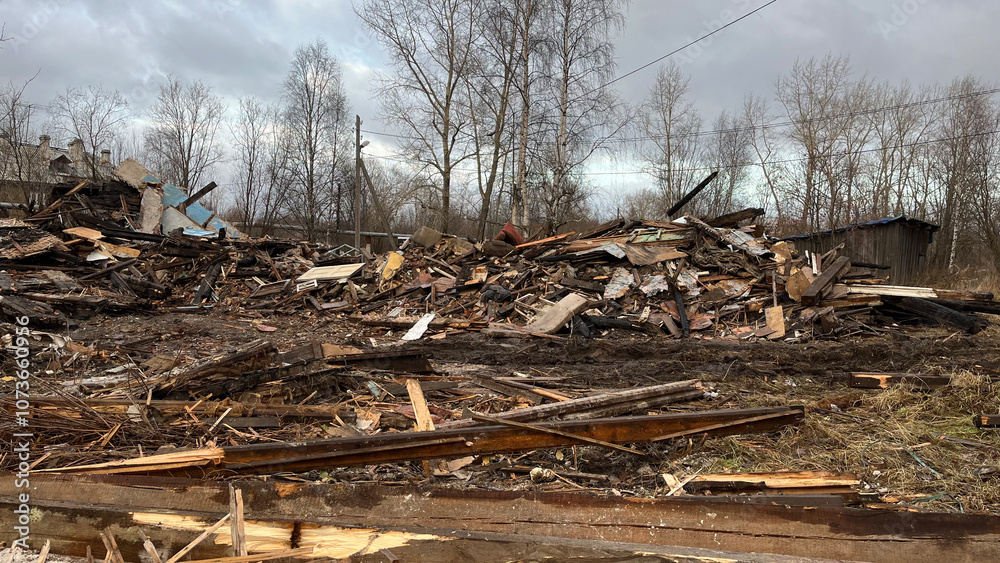 Ruins of a Collapsed Wooden House with Construction Debris and Wreckage, Post-Demolition Scene Ruins of a Collapsed Wooden House with Construction Debris and Wreckage, Post-Demolition Scene