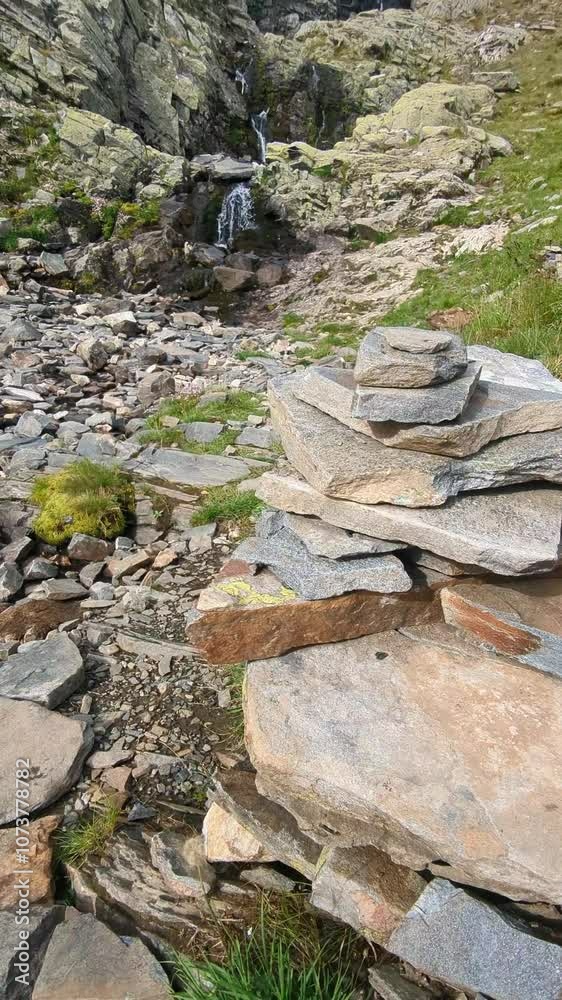 A mountain stream flows atop the peaks of Rila Mountains, Bulgaria, near the Seven Rila Lakes. A mountain stream flows atop the peaks of Rila Mountains, Bulgaria, near the Seven Rila Lakes.