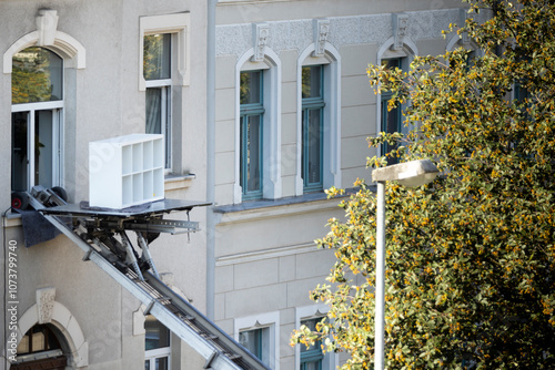Moving furniture from an apartment with the help of an electrical moving lift
