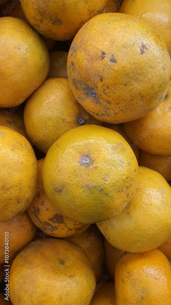 Close up pile of tasty fresh oranges sold at the market as a background. Close up pile of tasty fresh oranges sold at the market as a background.