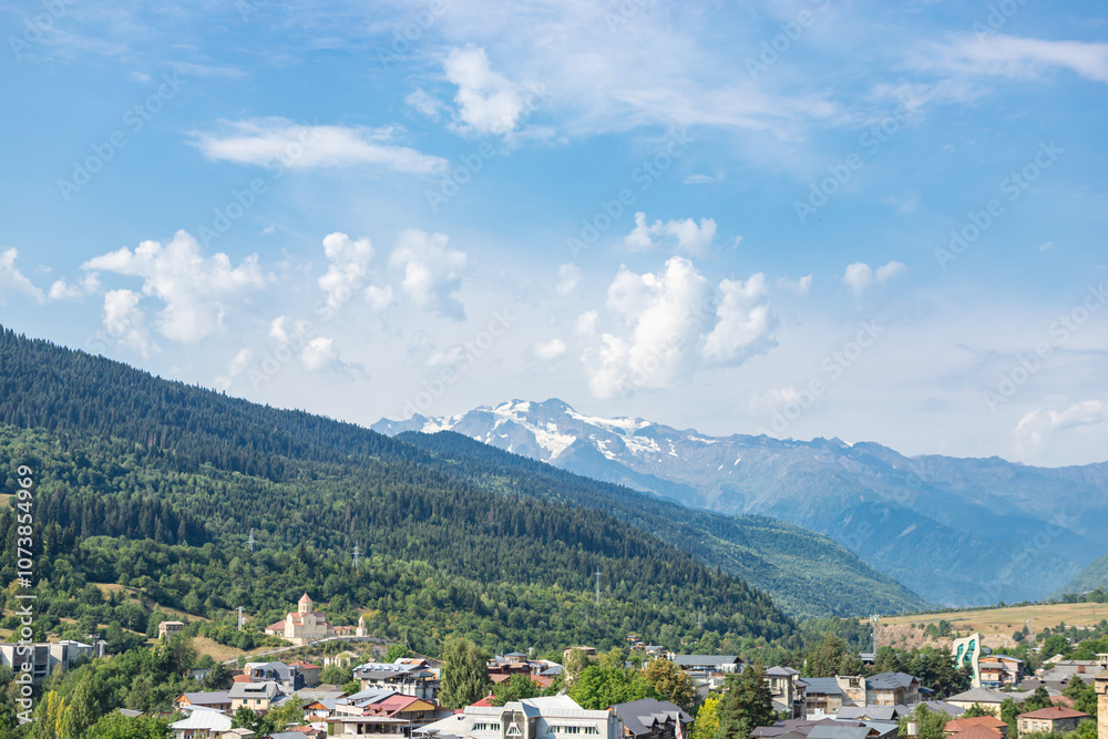 Mestia town in Georgia. The medieval Svan Towers is a traditional fortified residence in Mestia, Georgia. Svan towers and structures surrounded by green colors.