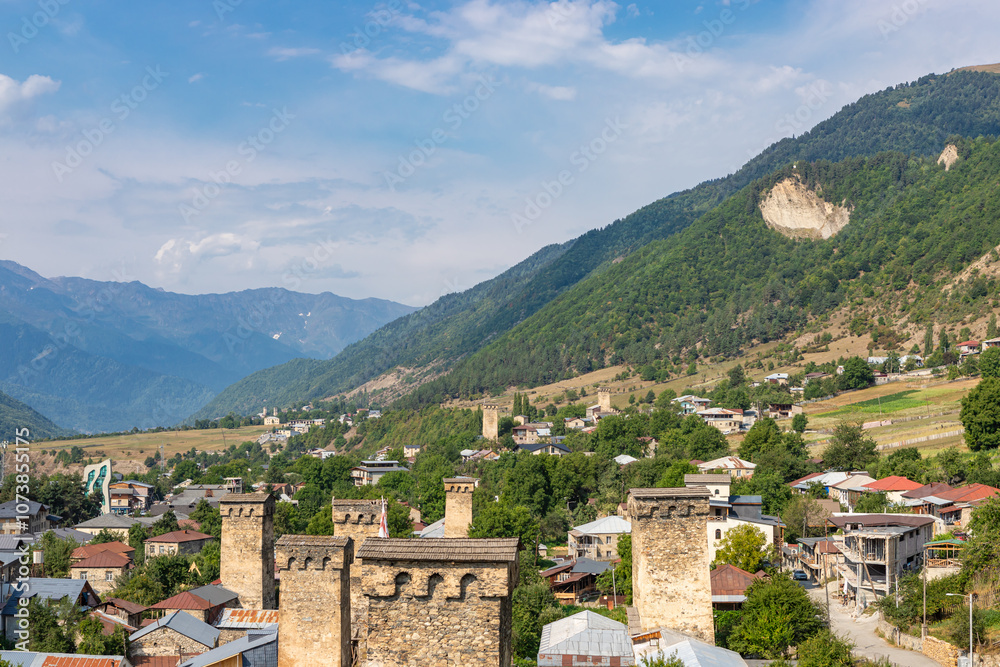 Mestia town in Georgia. The medieval Svan Towers is a traditional fortified residence in Mestia, Georgia. Svan towers and structures surrounded by green colors.