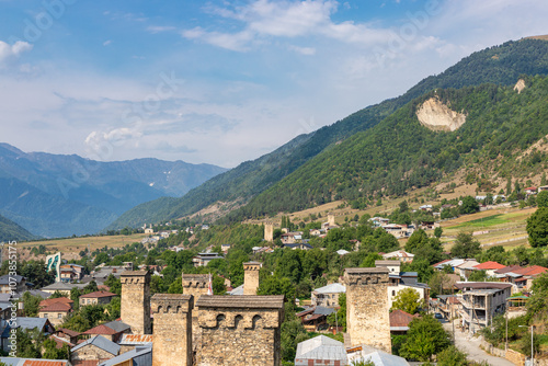 Obraz na płótnie Mestia town in Georgia. The medieval Svan Towers is a traditional fortified residence in Mestia, Georgia. Svan towers and structures surrounded by green colors. w salonie