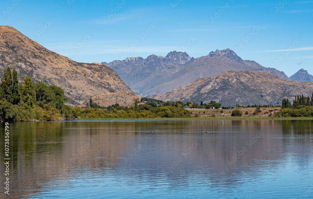 Gorgeous views of lake hayes in New zealand clear day hills Gorgeous views of lake hayes in New zealand clear day hills