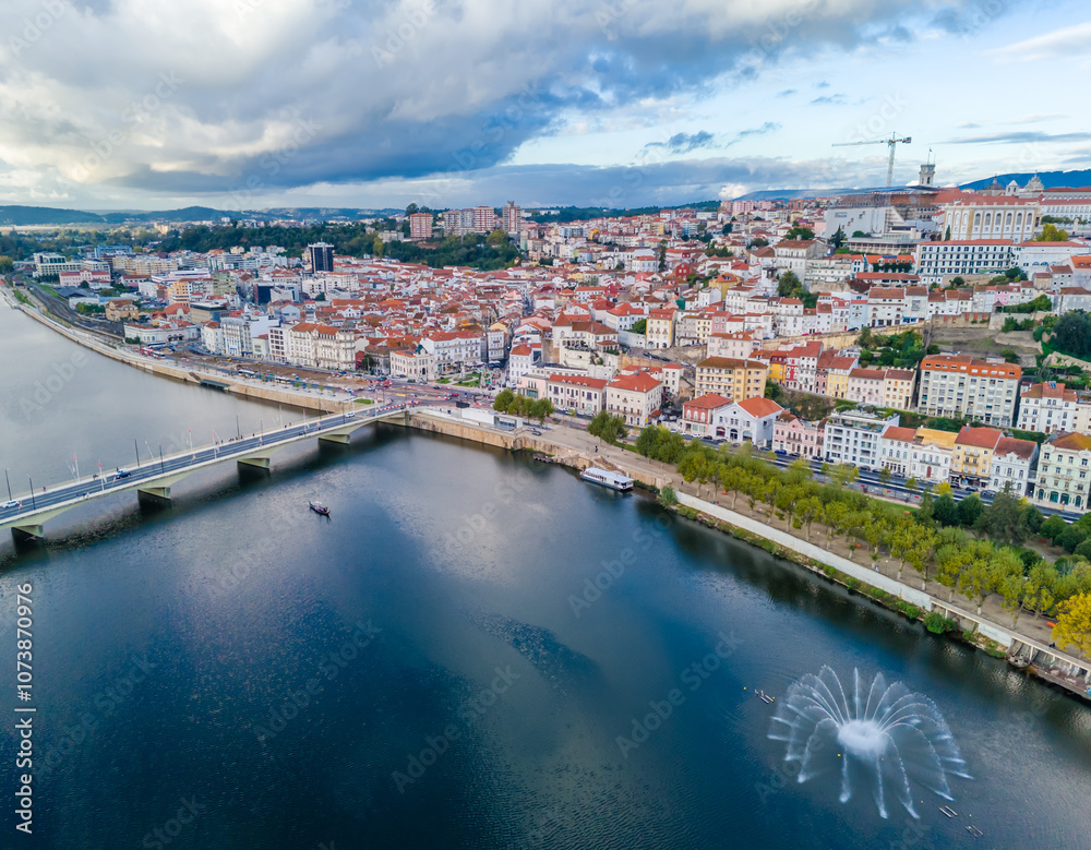 Fototapeta premium Aerial view of Coimbra city old town on the hill. Panoramic drone cityscape and Mondego River, Portugal
