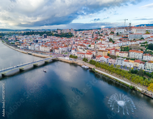 Aerial view of Coimbra city old town on the hill. Panoramic drone cityscape and Mondego River, Portugal