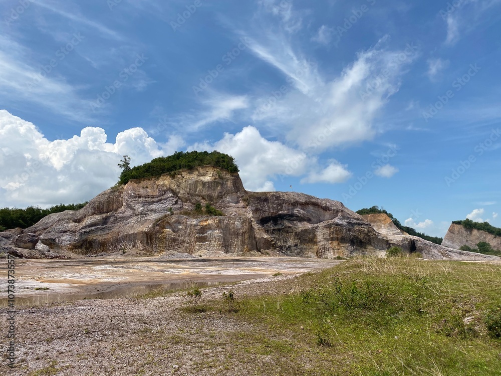 landscape with rocks, a blue sky, in a hidden valley in the country side of South East Asia landscape with rocks, a blue sky, in a hidden valley in the country side of South East Asia