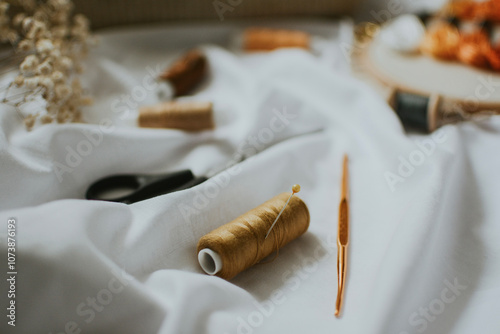 orange ball of thread close-up for sewing with needle for handicrafts and knitting 