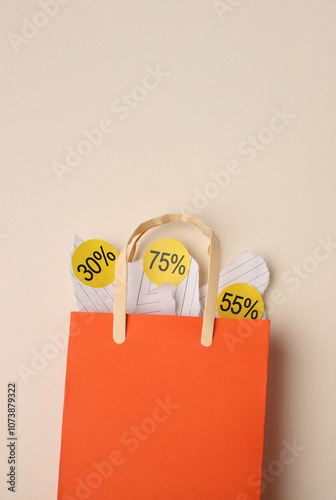Paper crafts shopping bags shirts and gifts on color background, discount shopping and shopping concept. Black Friday