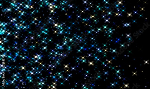 Sparkling stars on black background. Yellow and blue glittering space. 