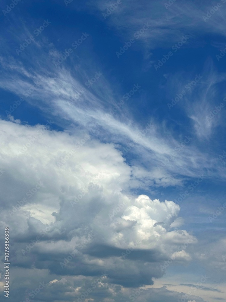 Puffy clouds in the blue sky Puffy clouds in the blue sky
