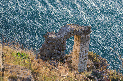 Roman arched gate, part of a fortress on a rocky seashore. Cape Kaliakra, Bulgaria