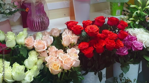 Slow motion footage of the variety of roses and other flowers in flower shop. Gift