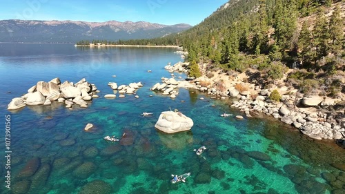 Lake Tahoe - Group of Kayakers Over Clear Water on Summer Day