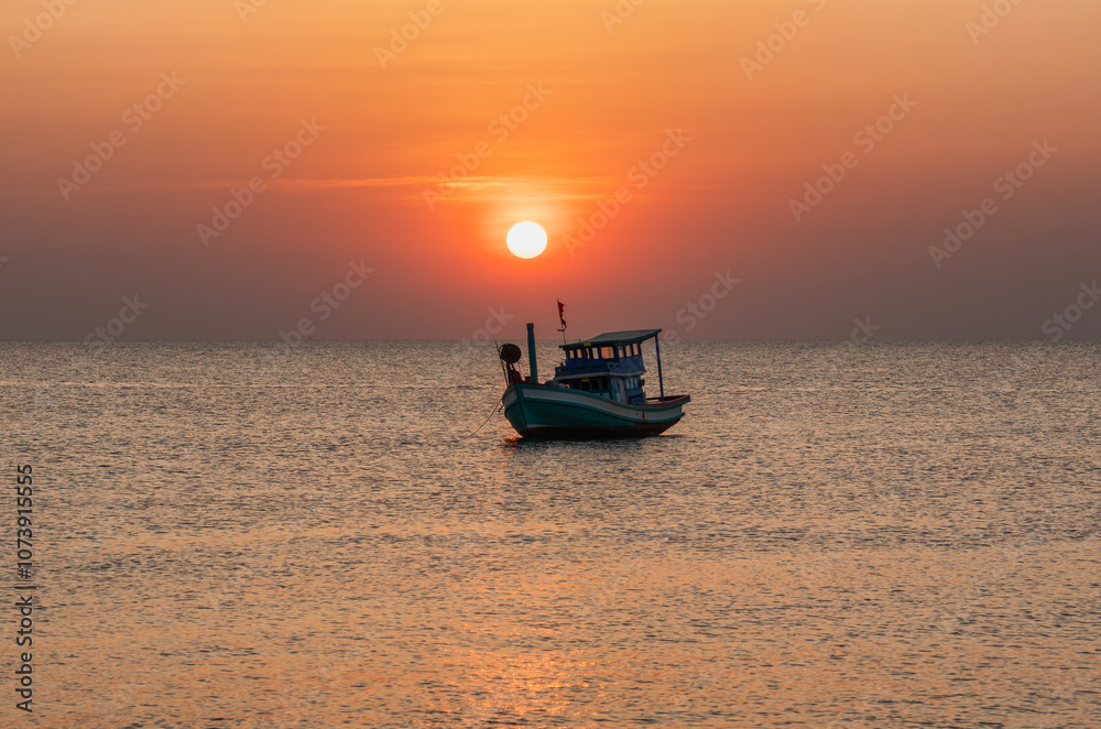 A scenic sunset at sea with a boat surrounded by calm waters and a fiery sky in the background. The setting sun adds a soft glow to the frame A scenic sunset at sea with a boat surrounded by calm waters and a fiery sky in the background. The setting sun adds a soft glow to the frame