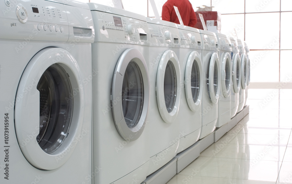 Rows of modern washing machines in a store Rows of modern washing machines in a store