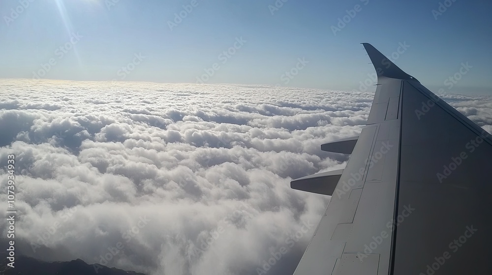 View from the plane: Clouds above the mountains, clouds and sky, clouds in the foreground, clouds in the background, a cloudy sky․ View from the plane: Clouds above the mountains, clouds and sky, clouds in the foreground, clouds in the background, a cloudy sky․