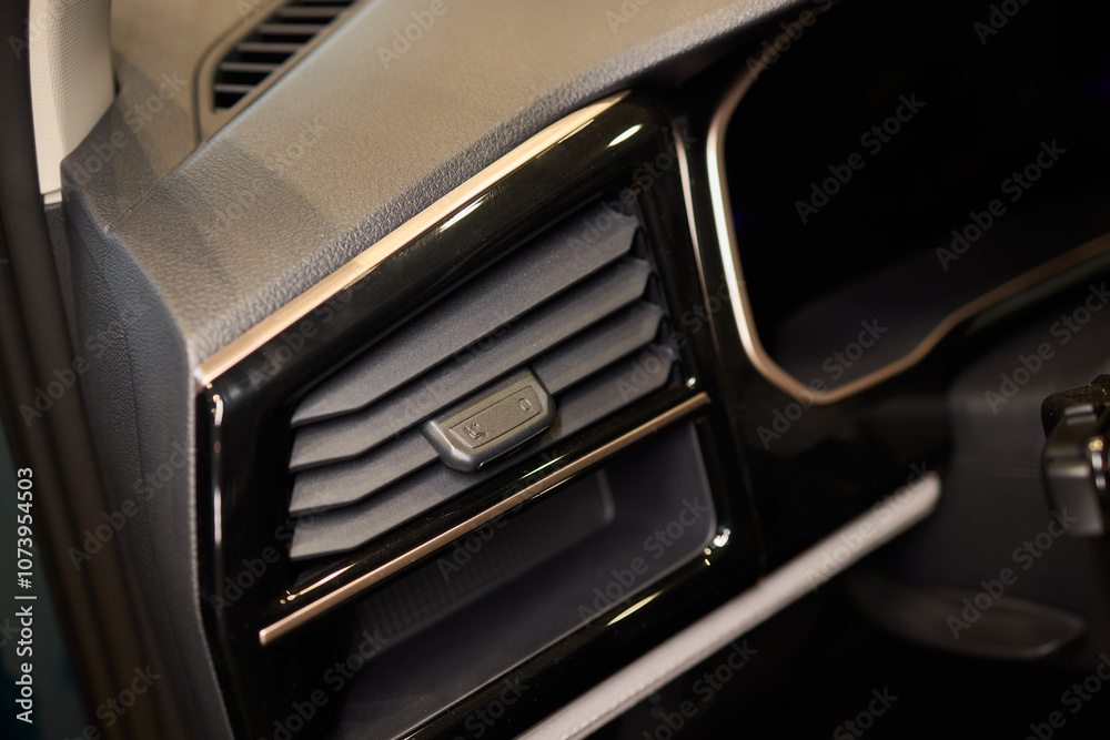 Closeup of car dashboard air vents near gear shift Closeup of car dashboard air vents near gear shift