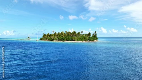 Drone Tuamotu atoll. Aerial view motu island Rangiroa island in French Polynesia. Tropical beach, palm trees and clear ocean water. Exotic travel destination for honeymoon
