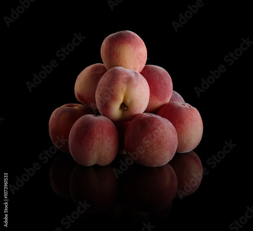 Fresh peaches on black background