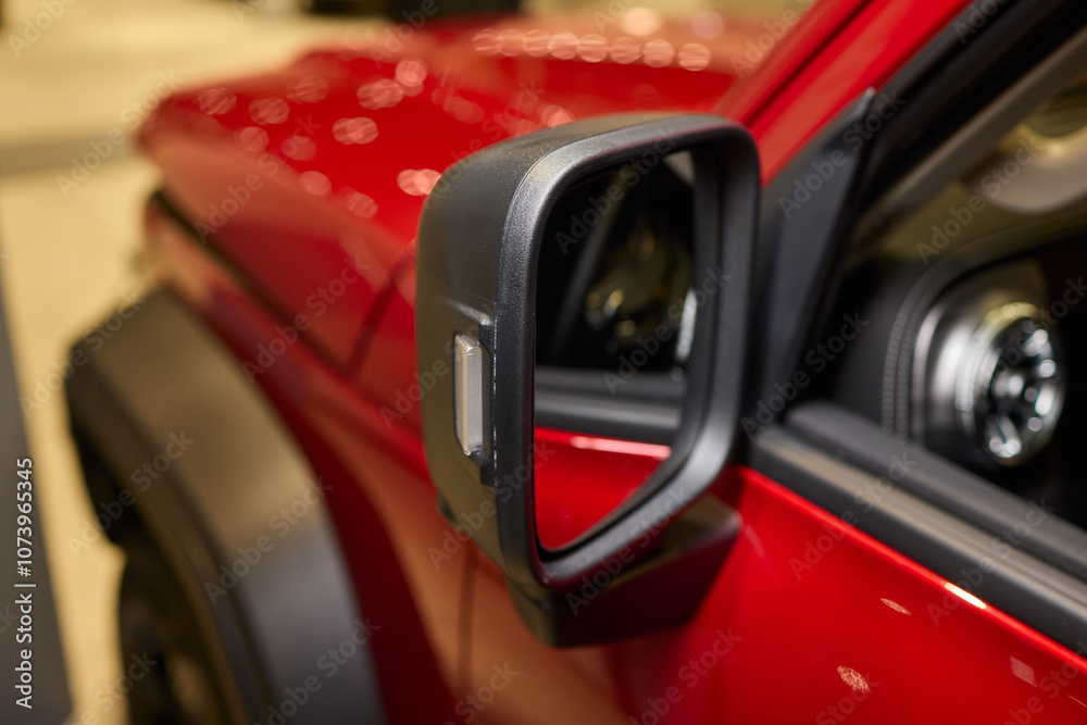 Fototapeta premium An elegant closeup shot of a sleek car side mirror showcasing its design and details